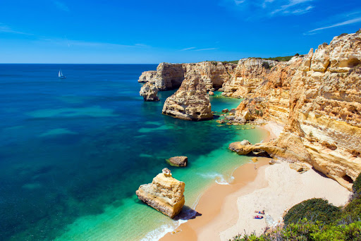 Panoramic view of the Algarve coastline with golden cliffs and turquoise ocean