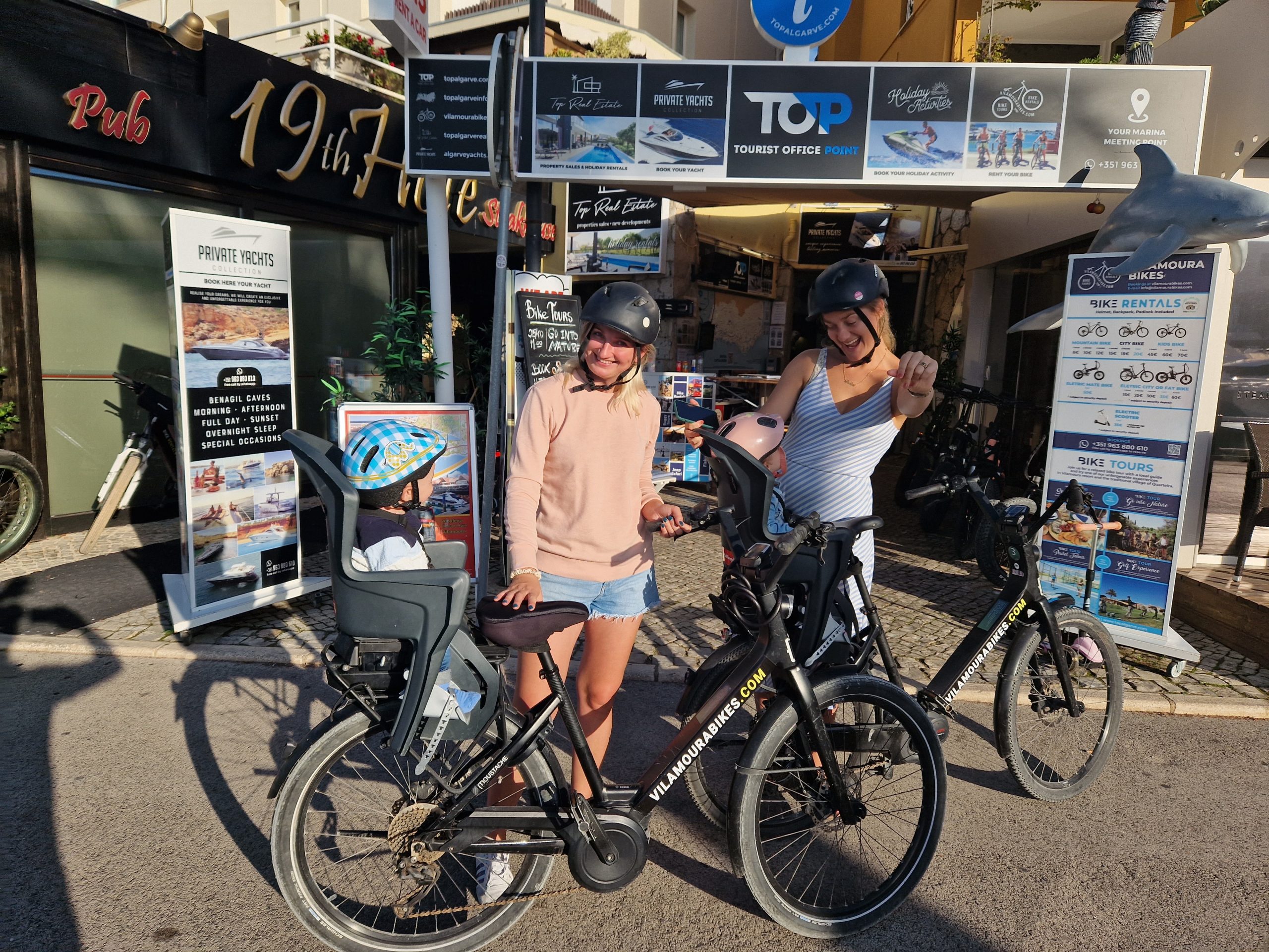 Family with children enjoying a sunny beach in the Algarve