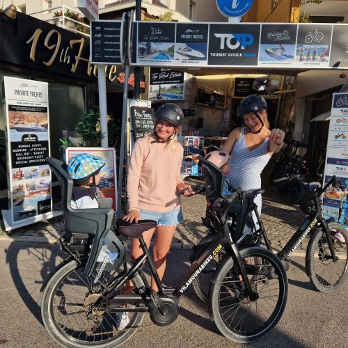 Family with children enjoying a sunny beach in the Algarve