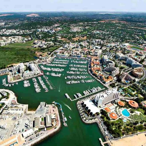 Vilamoura Marina with luxury yachts and waterfront promenade in the Algarve